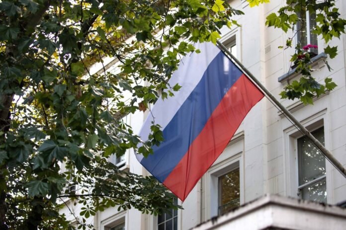 Britain expels Russian envoy in protest against spy wave


