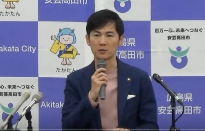 Akitakata Mayor Shinji Ishimaru speaks during a news conference in this screenshot taken from the city's YouTube channel.