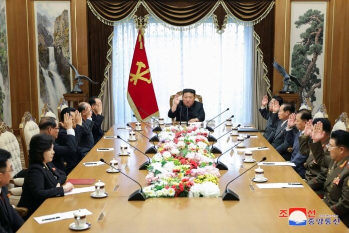 North Korean leader Kim Jong Un attends a meeting of the country's Politburo at an undisclosed location on Friday. 