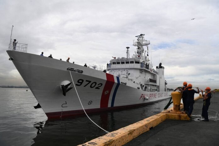 Philippine Coast Guard personnel work as the 97-meter coast guard multirole response vessel, the BRP Melchora Aquino, arrives from Japan at the international port in Manila in June 2020. 