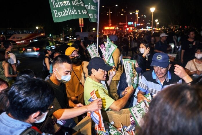 Taiwanese protesters gather as opposition pushes through controversial law


