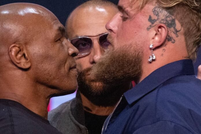 Former heavyweight boxing champion Mike Tyson (left) and YouTuber Jake Paul face off during a news conference in New York on May 13. 