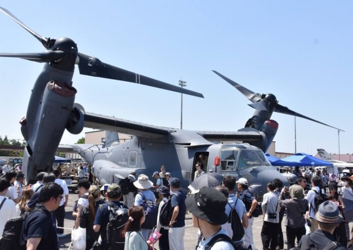 Visitors view a CV-22 Osprey on display during a friendship event at the U.S. military's Yokota Air Base in Tokyo on Saturday. 