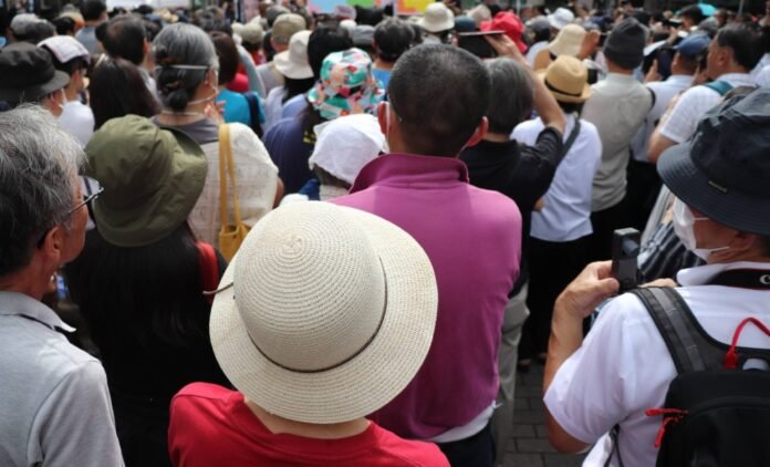 Voters listen to a stump speech in Tokyo on Saturday.  