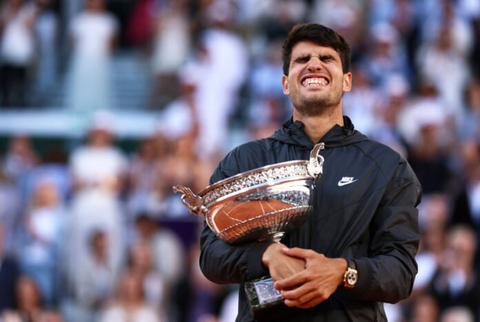 Carlos Alcaraz celebrates with the trophy after beating Alexander Zverev in the French Open final at Roland Garros in Paris on Sunday. 