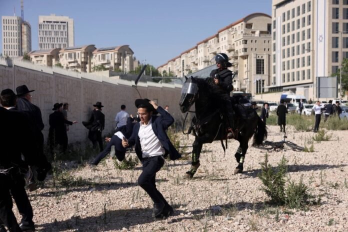 Clashes as Israeli parliament votes on ultra-Orthodox conscription law


