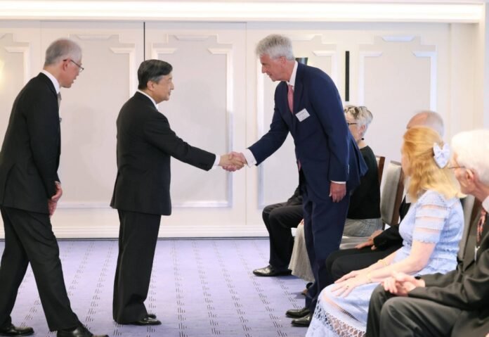 Emperor Naruhito meets with British people with connections to Japan at a hotel in London on Sunday. 