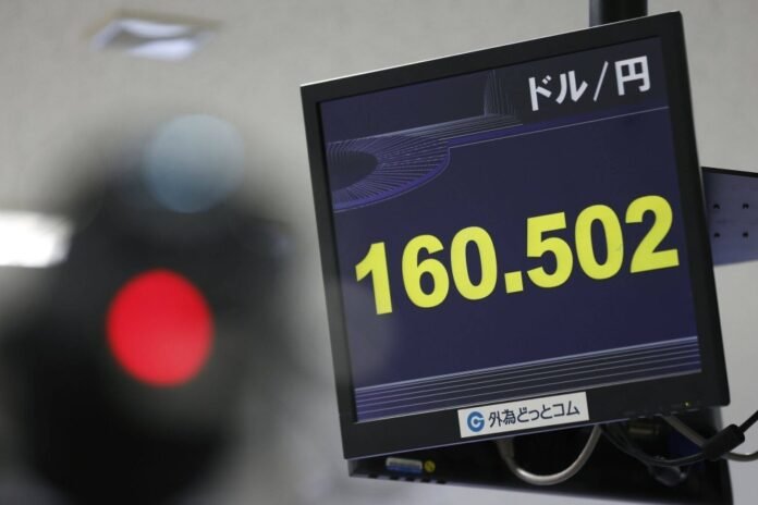 The rate of the yen against the U.S. dollar is displayed in Tokyo on Thursday. 