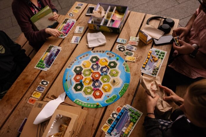 In Catan: New Energies, players must decide between fossil fuels and clean energy. 