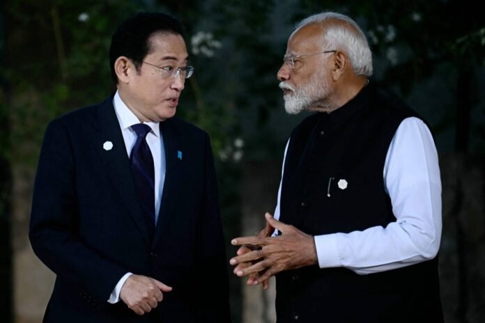 Prime Minister Fumio Kishida speaks with Indian Prime Minister Narendra Modi during the G7 summit in Italy's Apulia region on Friday. 