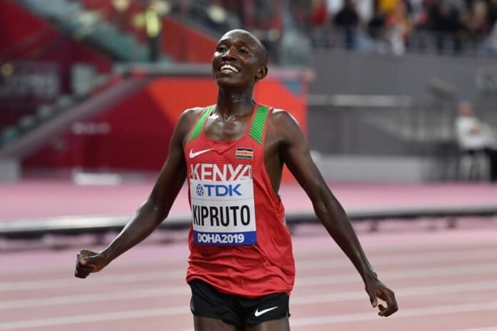 Kenya's Rhonex Kipruto celebrates after finishing third in the men's 10,000 meter final at the 2019 IAAF Athletics World Championships in Doha on Oct. 6, 2019. 