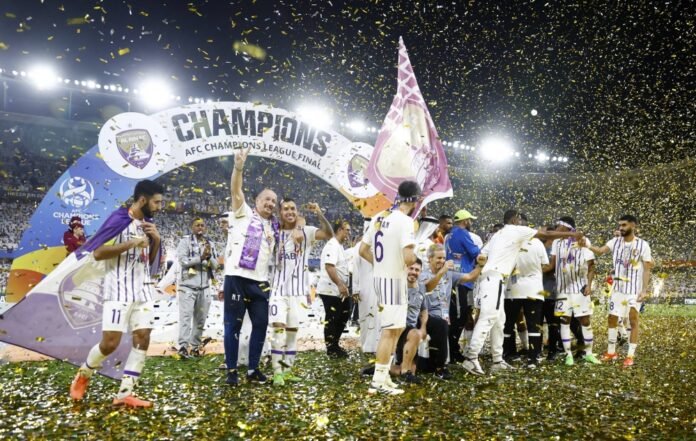 Al Ain players and coaches celebrate after winning the AFC Champions League final over Yokohama F. Marinos on May 25.  