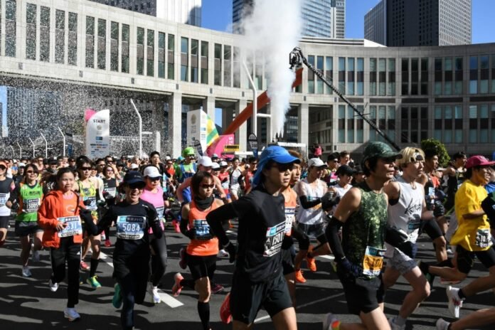 Runners get started in the Tokyo Marathon 2024 in March. 