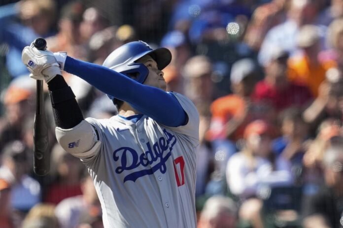 Shohei Ohtani hits a home run in the third inning; seven runs in the 11th inning as the Dodgers beat the Giants 14-7

