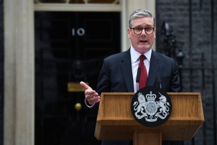 British Prime Minister Keir Starmer delivers the first speech of his premiership outside No. 10 Downing St. in London on Friday, following his Labour Party's win in the general election. 