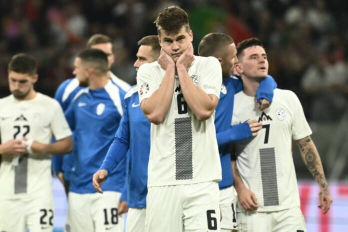 Slovenia's players react after the team's Euro 2024 round of 16 defeat to Portugal in Frankfurt on Monday. 