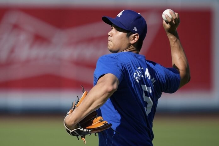 Dodgers' Shohei Ohtani throws from mound for first time since elbow surgery last fall

