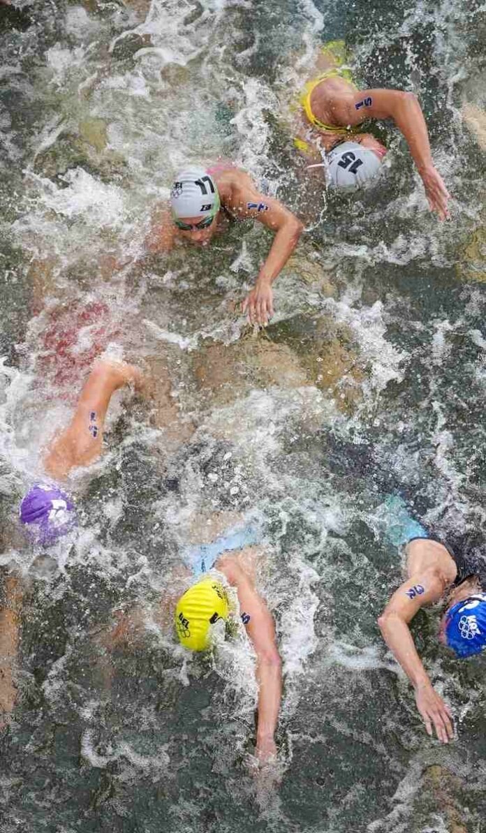 Paris 2024 Olympic Games: Olympic triathletes swim in the Seine River after days of concerns over water quality

