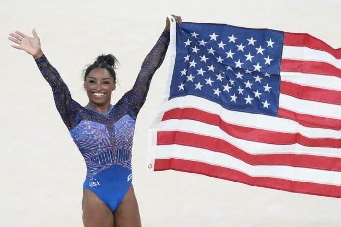 Simone Biles makes history with second all-around Olympic gymnastics title, 8 years after her first

