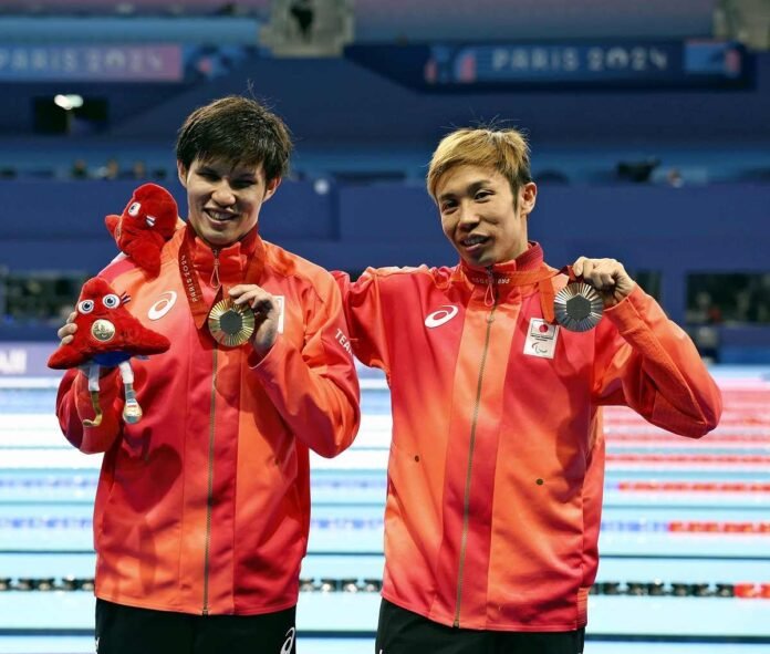 Kimura takes 2nd gold in men's 100m butterfly, breaking his personal record from the Tokyo Games

