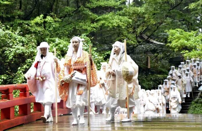 Women begin the ancient Yamabushi mountain priest training in Yamagata Pref.; participants train by running through forests and meditating under waterfalls

